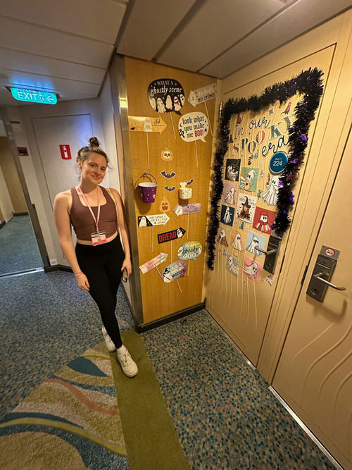 Emma Weissmann stands next to a decorated stateroom door on Allure of the Seas. Emma Weissmann stands next to a decorated stateroom door on Allure of the Seas.